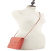 Coral quilted handbag on mannequin